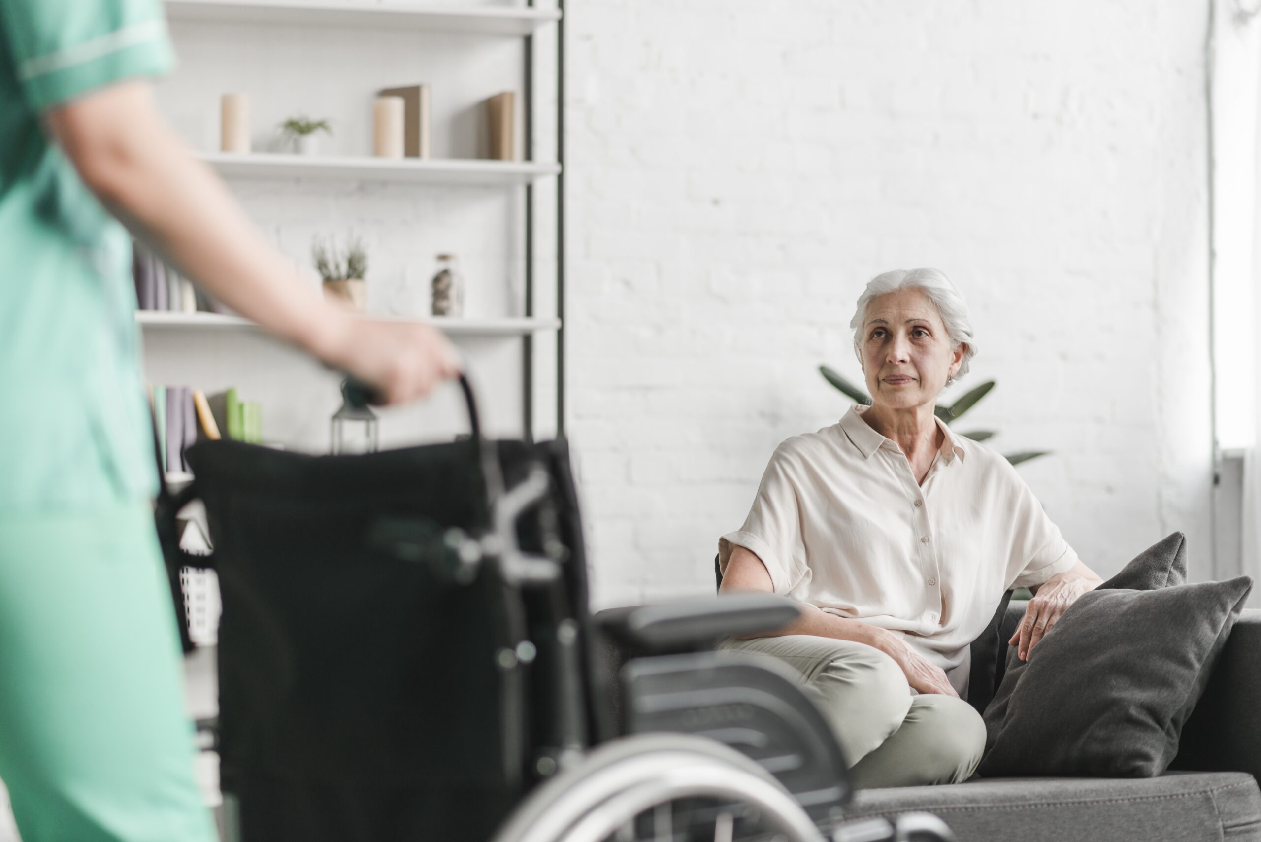 Nurse supporting an older care-home resident
